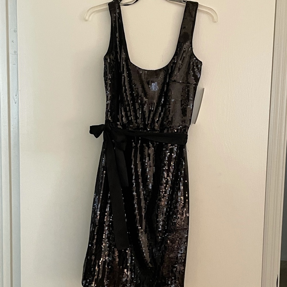 Sequined little black dress